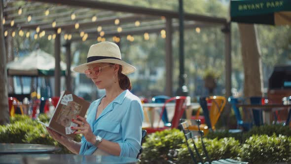 Attractive girl in a cafe, NYC alt