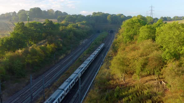 train aerial view. The movement of a train at high speed between the vineyards, top view.  alt