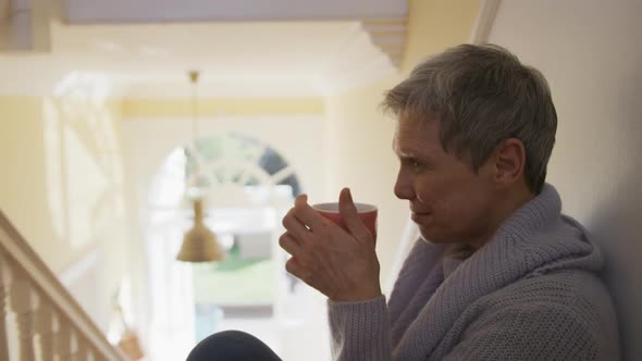 Senior woman at home alone alt