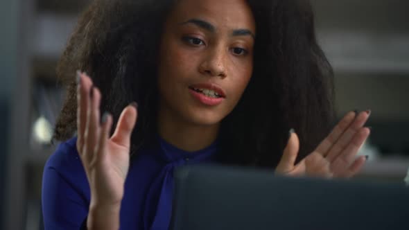 Beautiful African American Ceo Woman Calling Video on Computer Laptop in Cafe alt