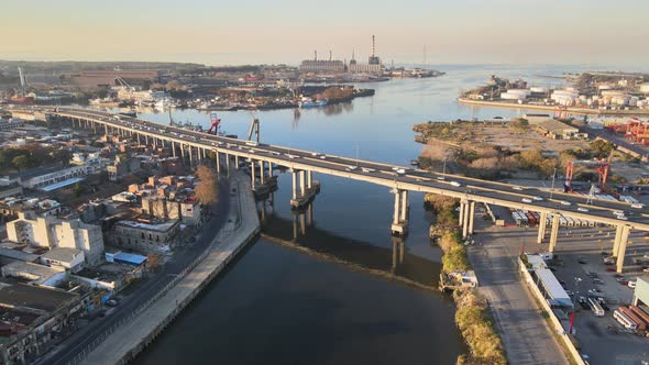 Static aerial of highway traffic on bridge over water in Buenos Aires alt
