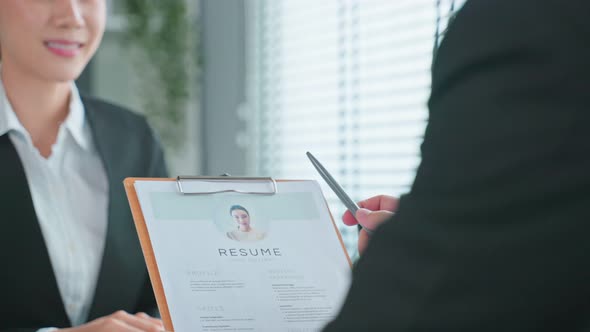 Close up of woman give resume to hr manager for job interview in office. alt