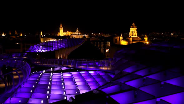 Magical nighttime illumination on the Setas de Sevilla. Aurora Experience and the skyline of Sevilla alt