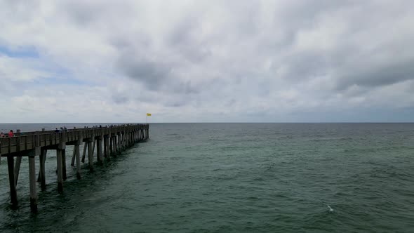 Pensacola Beach Fishing pier on Casino Beach in Florida - Aerial Drone Flying View alt