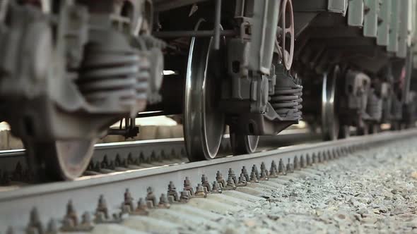 The Wheels of Old Train on the Railway Track Passing By Camera. Close Up Shot alt