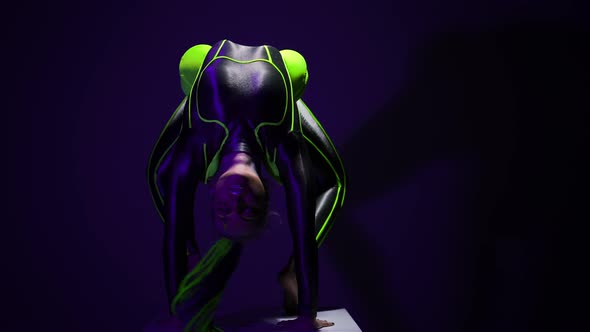 Young Slim Woman Standing in Back Walkover Pose Moving Looking at Camera alt