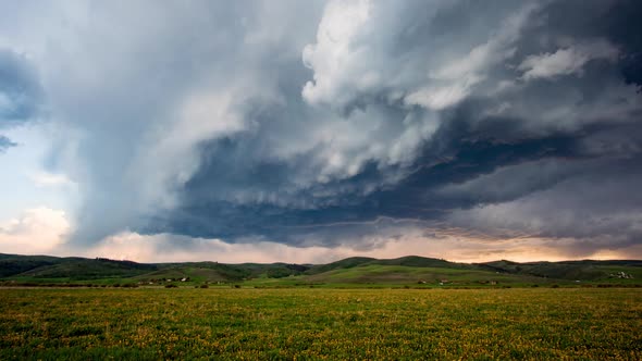 Clouds rolling as storm builds over landscape in Wyoming alt