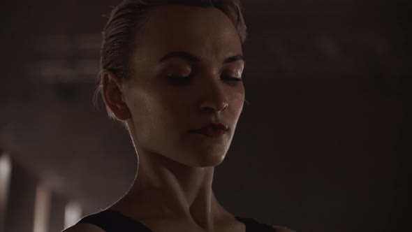 A Slowly Dancing Ballerina in Front of Spot Lights alt