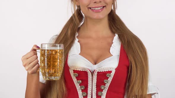 Gorgeous Oktoberfest Woman in Sexy Dirndl Dress Holding Beer Showing Thumbs Up alt
