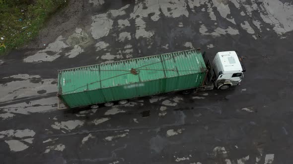 The Car Wagon Truck Bringing a Container for Unloading in the Warehouse alt