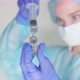 Doctor draws medicine into a syringe - VideoHive Item for Sale