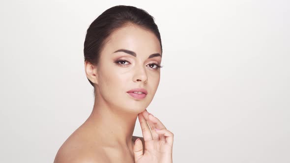 Studio portrait of young and beautiful brunette woman over alt