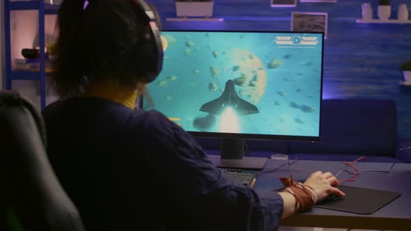 Excited Pro Gamer with Professional Headphones Making Winner Gesture alt