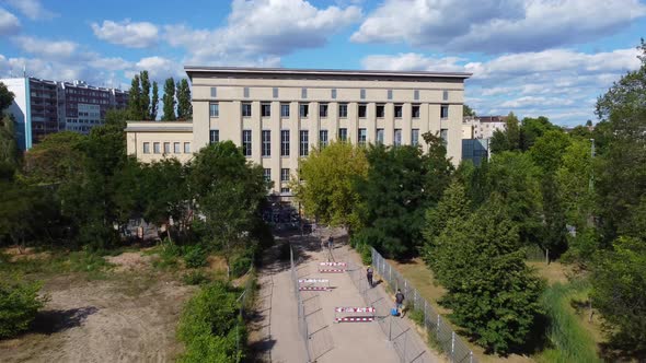 Perfect aerial view flight fly backwards drone footage of the toughest Club door Bouncer in the Worl alt