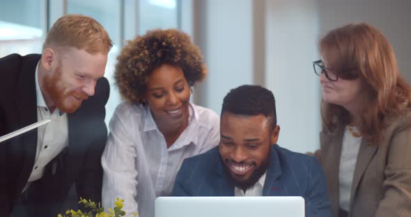 Professional Multiethnic Business Team Working on Startup Project with Computer alt