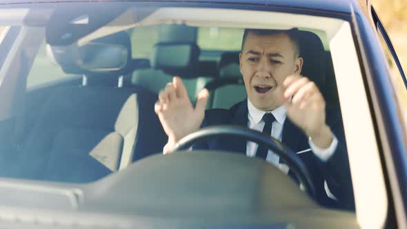 Business Man Driving Vehicle With Negative Emotions