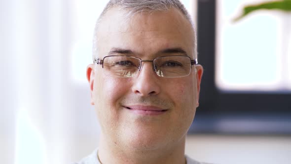 Portrait of Happy Smiling Man in Glasses  alt