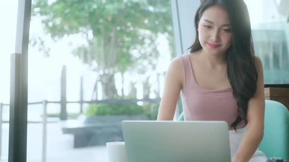 Smart positive asian female businessman video conference remote working alt