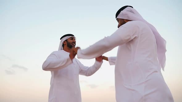 Young men spending a day in the dubai desert alt
