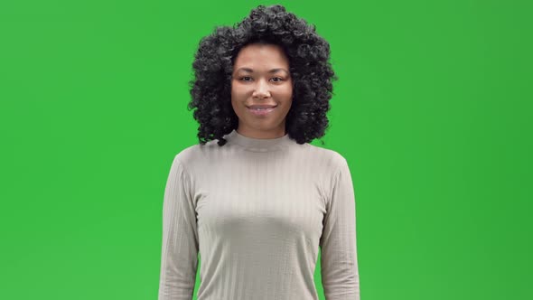 Green Screen Attractive African Female Shows Sing Thumb Up