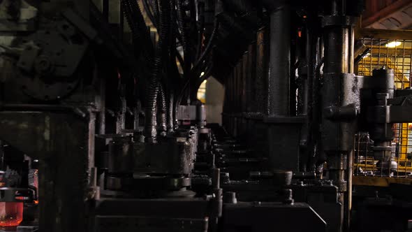 The process of making glass bottles in slowmotion glassworks alt