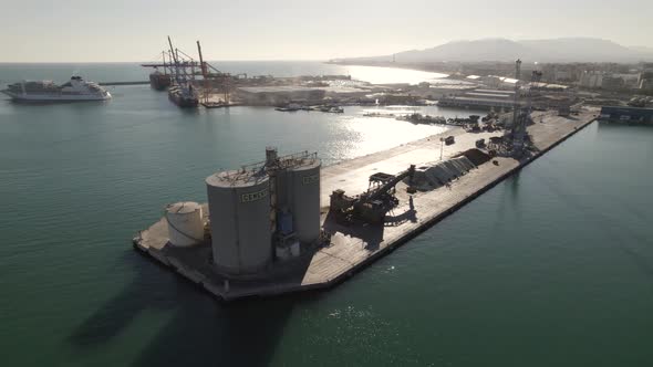 Industrial area and cement discharge basin, Malaga port, Spain. Aerial panoramic view
