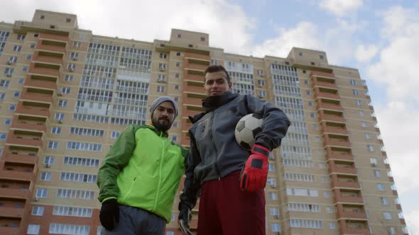 Portrait of Two Soccer Players Posing on Outdoor Field alt