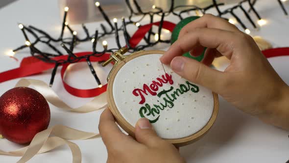 Merry Christmas wooden hoop embroidery as decoration for home or Christmas tree. alt