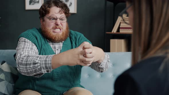 Weird Chubby Guy Expressing Anger Gesturing and Grimacing During Consultation with Psychiatrist alt