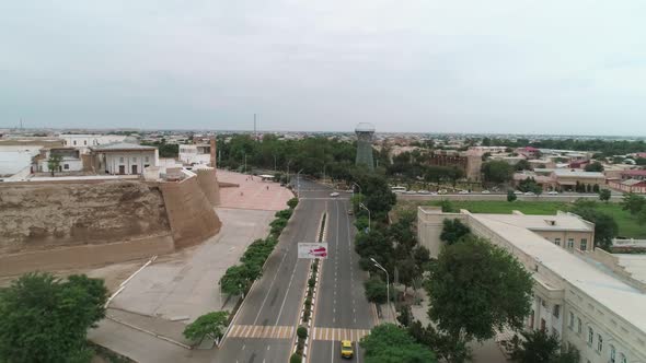Street Near the Front Gate Ark of Old Bukhara City Fortress a Filmed By Drone on a Warm Cloudy Day alt