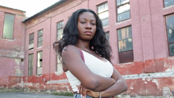 Black Girl On The Street. Young Girl On The Background Of The Building. alt