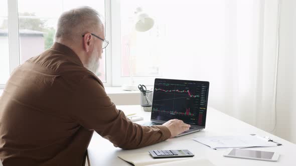 man is engaged in a trader at the stock market