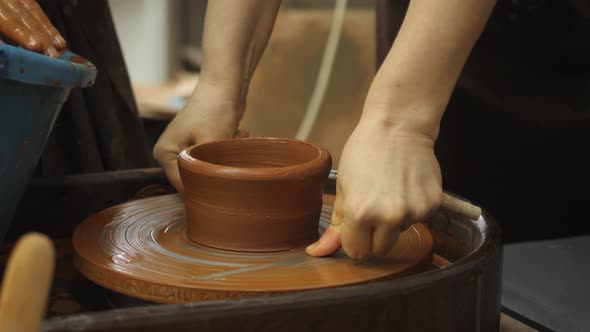 The Potter Removes the Blank From the Potter's Wheel with a Thin Fishing Line