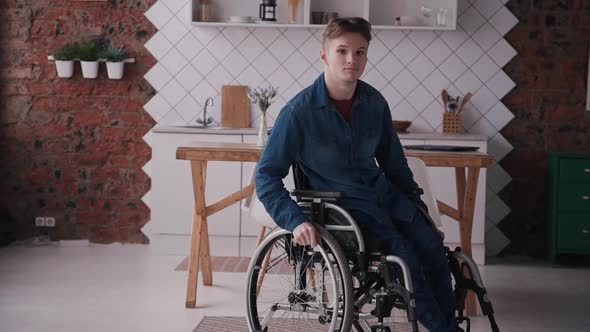 Adult Man in Sitting Wheelchair at Cozy House