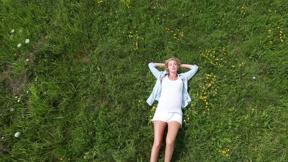 Top View Young Pregnant Woman in Meadow