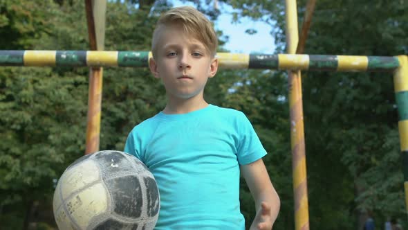 Serious Boy With Ball Looking Camera, Summer Healthy Activity, Motivation