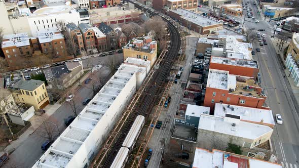 Train on Railroad Tracks for Commuters Using Public transportation in Chicago, Aerial View alt