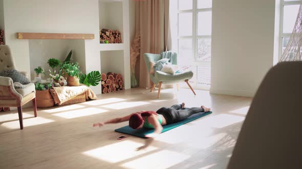 Athletic Woman Exercising at Home alt