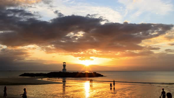 Khao Lak beach with lighthouse for navigation, Phang-Nga, Thailand; day to night - Time Lapse