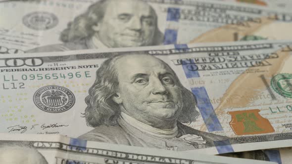 Paper USD  currency in 100 denominations slow tilt 4K 2160p 30fps UltraHD footage - Dollar  banknote alt