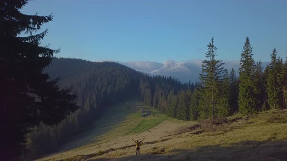 Flying Over Camping in Forest in the Mountains alt