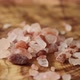 Pink Himalayan rock salt passes in front of the camera - VideoHive Item for Sale