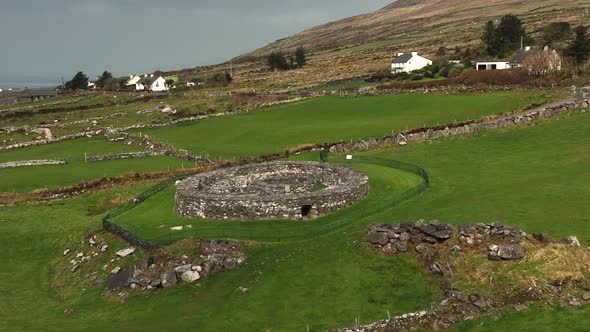 Loher Ringfort, Kerry, Ireland, March 2022. Drone orbits the ancient monument at a low altitude from alt