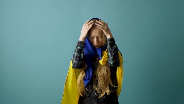 Young Woman with Ukrainian Flag on Head alt