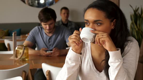 Girl Enjoys the Coffee Drinking at the Cafe alt
