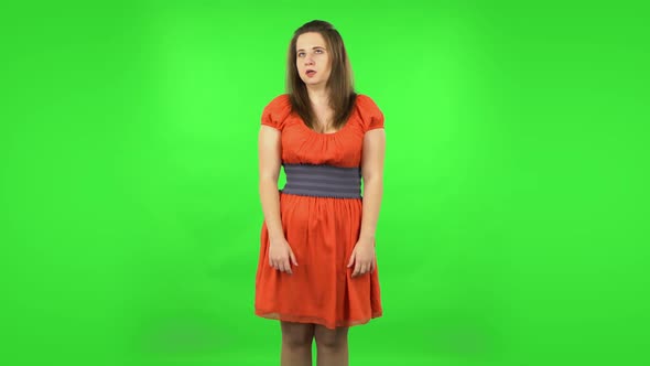 Cute Girl Is Upset, Waving Her Hands in Indignation, Shrugs alt