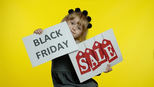 Cheerful Blonde Child Girl Showing Black Friday and Sale Word Advertisement Inscriptions Banners alt