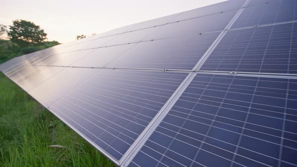 Closeup of Surface of Blue Photovoltaic Solar Panels Mounted on Field for Producing Clean Ecological alt
