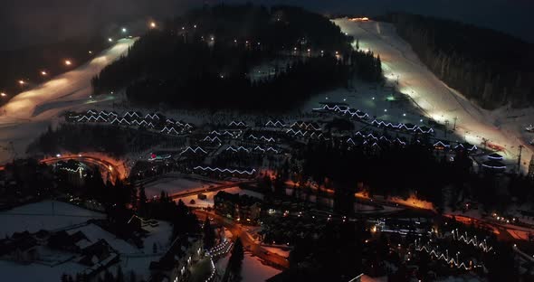 Night Illumination Cityscape Center Square Mountain Popular Ski Resort. Details of Modern House alt