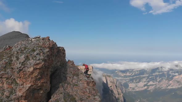 Aerial Shot of Group of Climbers Working with a Rope. Rescue Work Climbing To the Top of the alt